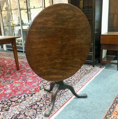 Appraisal: An th Century walnut circular tilt-top table turned column and