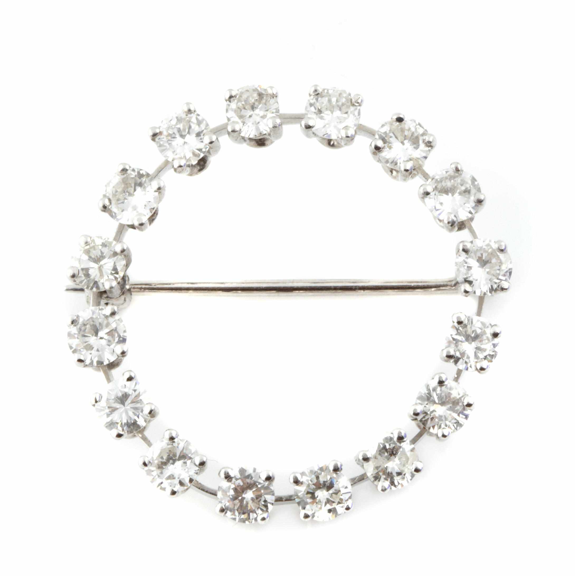 Appraisal: A diamond and white gold circle brooch estimated total diamond