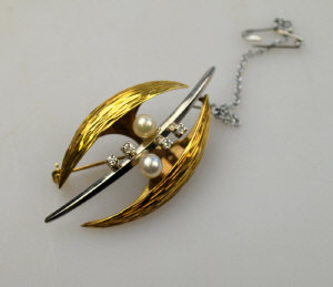 Appraisal: s ct yellow and white gold stylised leaf brooch set