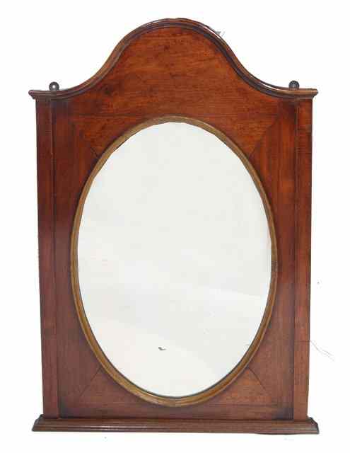 Appraisal: A TH CENTURY WALNUT HANGING WALL MIRROR with serpentine crest