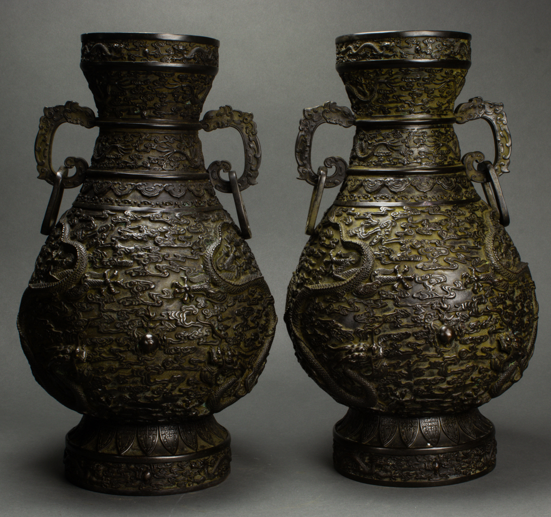 Appraisal: Pair of Chinese cast bronze 'dragon' vases each of hu