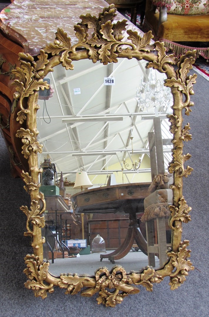 Appraisal: A th century gilt framed wall mirror with oak leaf