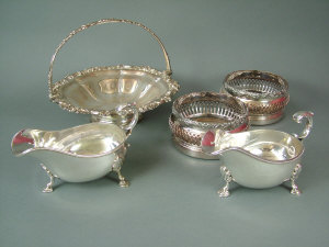 Appraisal: A pair of Victorian plated decanter coasters with lancet pierced