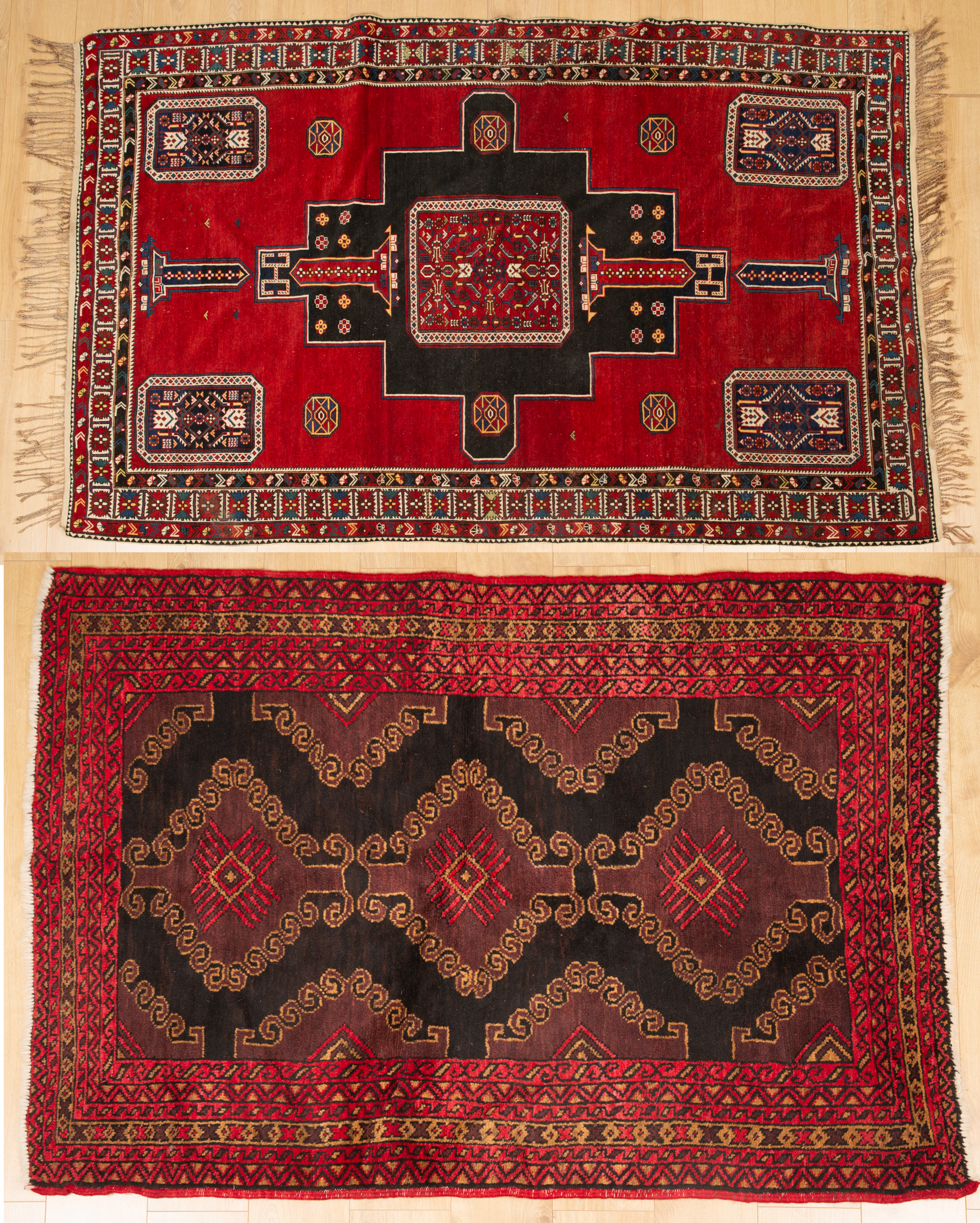 Appraisal: An antique red ground rug with central black ground motif