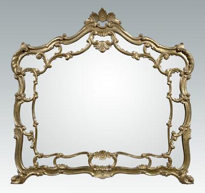 Appraisal: Rococo style carved gilt wood mirror arched top leaf and