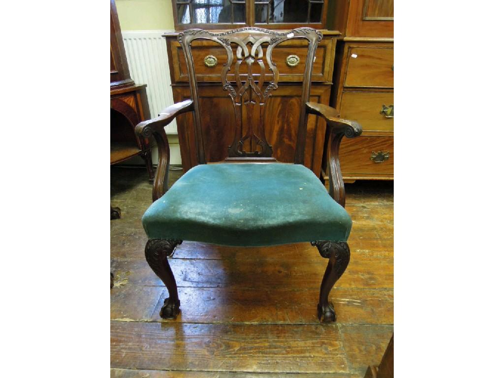 Appraisal: A Chippendale style mahogany open elbow chair with pierced interlaced