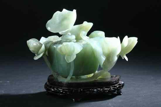 Appraisal: CHINESE GREEN JADE CENSER AND COVER Carved as a lotus