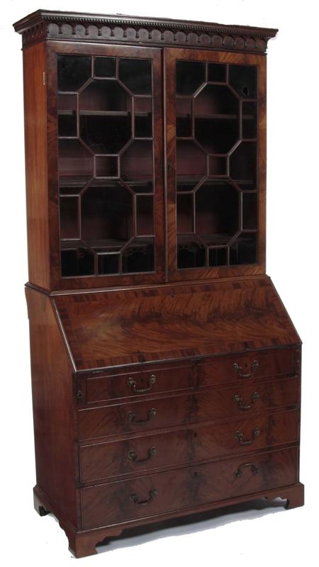 Appraisal: A George III mahogany bureau bookcase the dentil cornice with