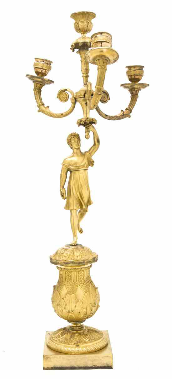 Appraisal: A Pair of Empire Gilt Bronze Figural Four-Light Candelabra cast