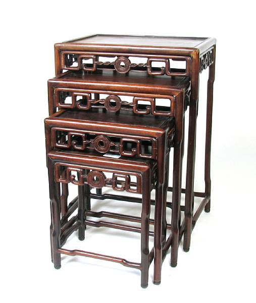 Appraisal: A nest of four Chinese wood tables repairs height of