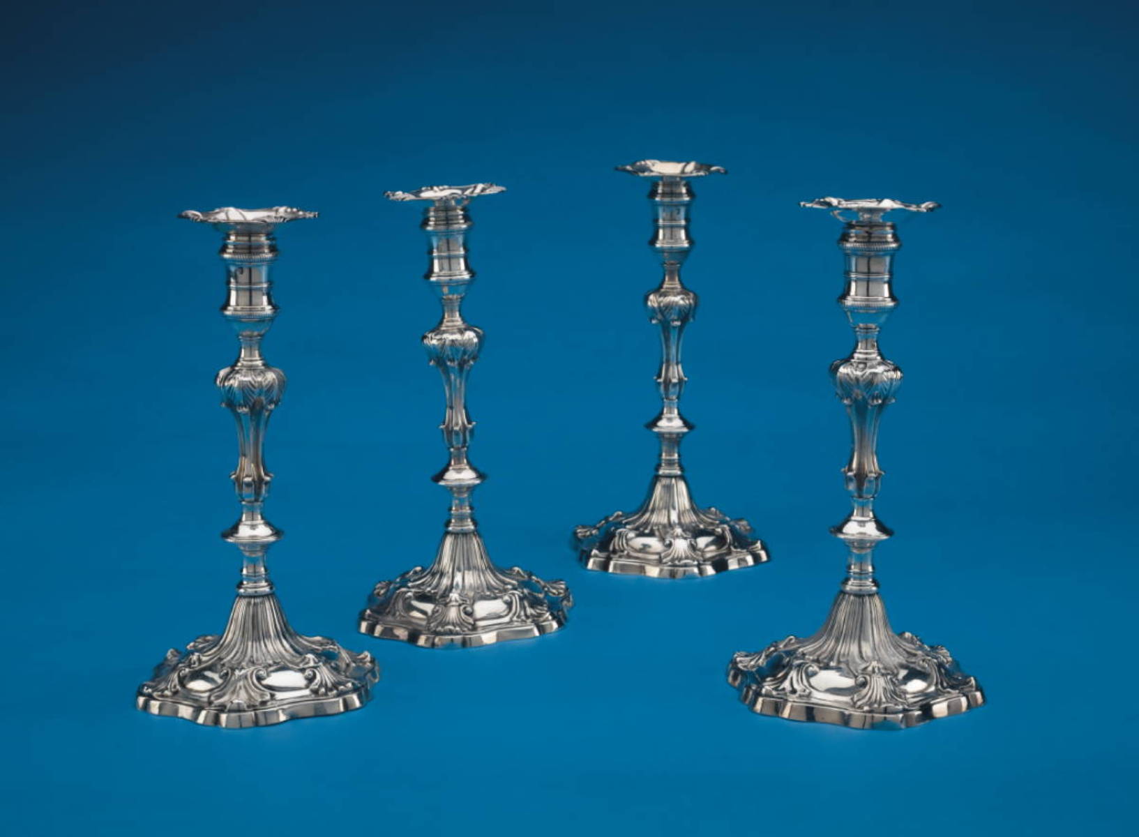 Appraisal: NEAR SET OF FOUR GEORGE II III SILVER CANDLESTICKS WILLIAM