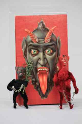 Appraisal: TWO COMPOSITION HEAD KRAMPUS IN BOX Two pipe cleaner stem