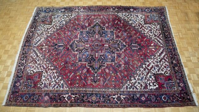 Appraisal: Mid th Century Heriz Carpet Dominant blue red and white