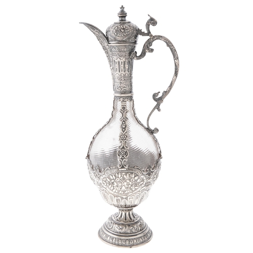 Appraisal: A Continental silver mounted wrythen fluted glass claret jug late