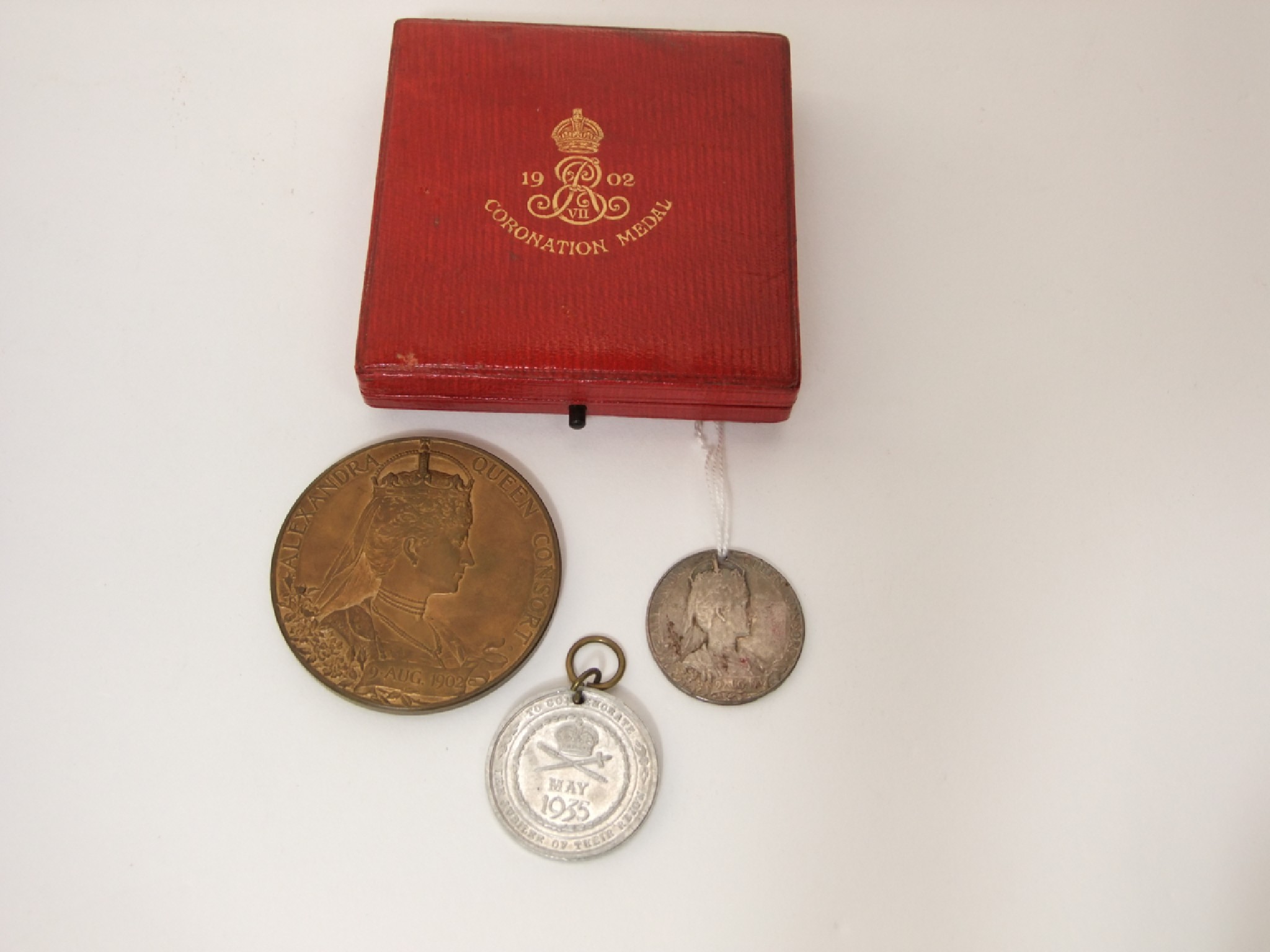 Appraisal: An Edward VII Coronation medallion in bronze cased and two