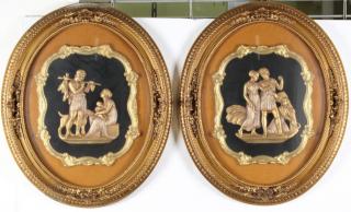 Appraisal: Pair Of Oval Framed Decorative Plaques The squared central cartouche