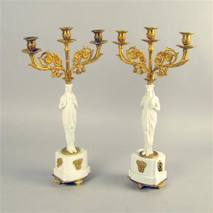 Appraisal: Pair of Empire style bisque porcelain and gilt bronze candelabra