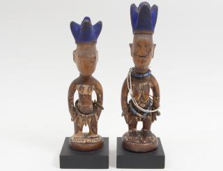 Appraisal: PAIR OF YORUBA IBEJI FIGURES Carved and painted as a