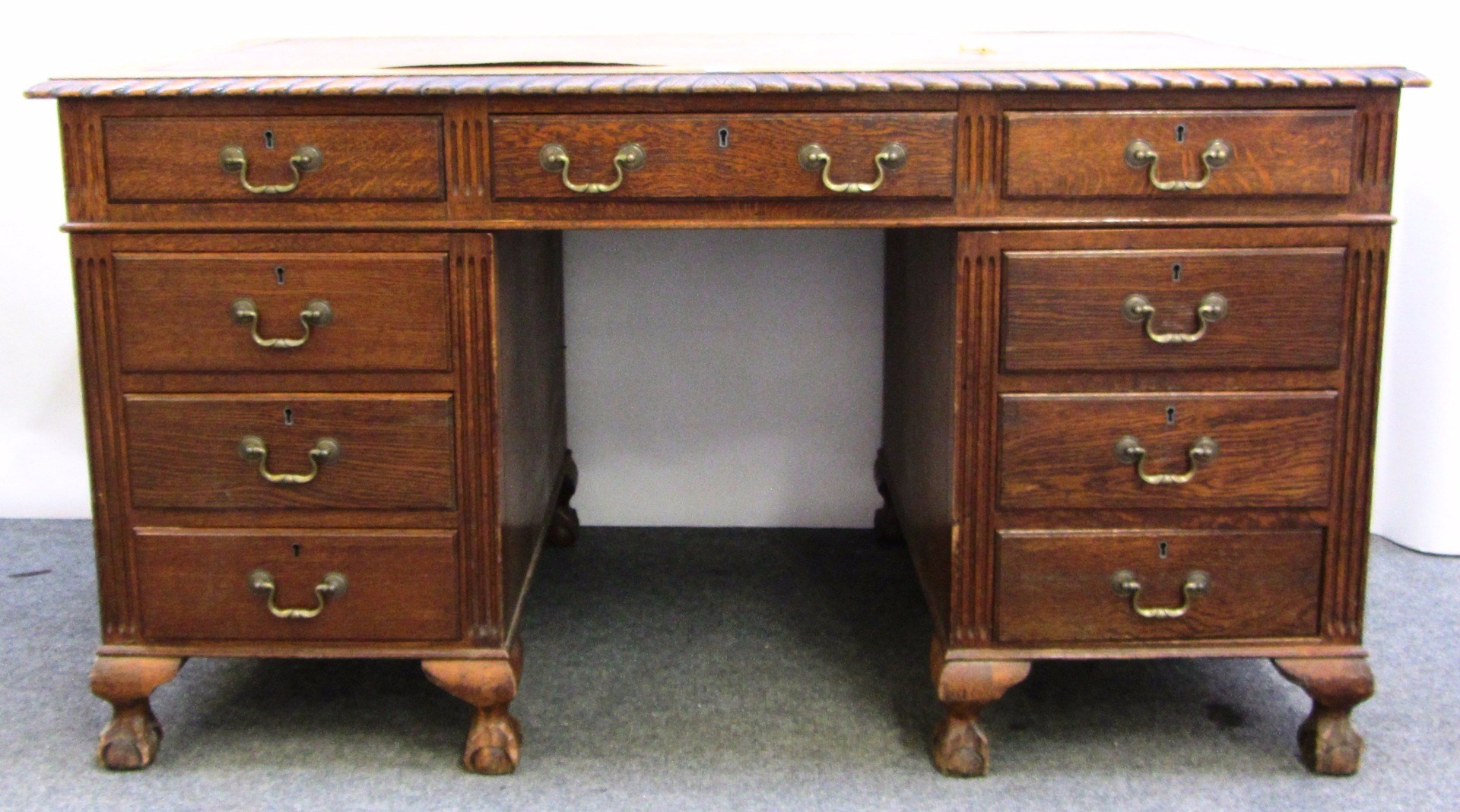 Appraisal: A th century oak pedestal desk with gadrooned top over