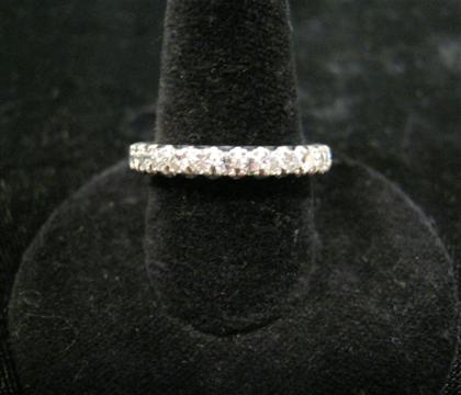 Appraisal: Lady's platinum and diamond eternity bandClassic prong set round cut