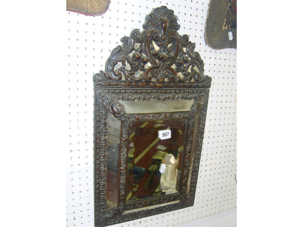 Appraisal: An th century continental brass mounted wall mirror with raised