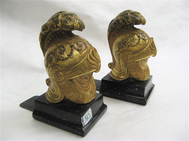 Appraisal: PAIR BORGHESE BOOKENDS gilt wood Roman Soldier Helmets attached to