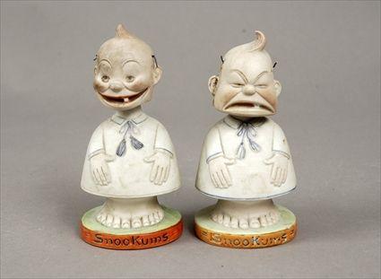 Appraisal: Two Polychrome Biscuit Porcelain Bobbing-Head Snookums Figures to in