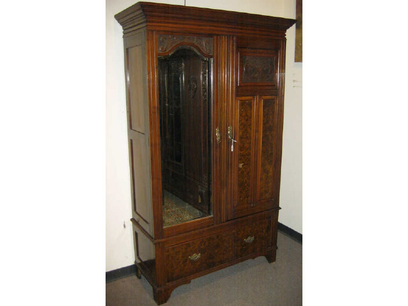 Appraisal: ENGLISH WALNUT WARDROBE Molded cornice rests above the rectangular case