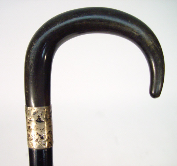 Appraisal: Two walking canes one with ebonised shaft and silver collar