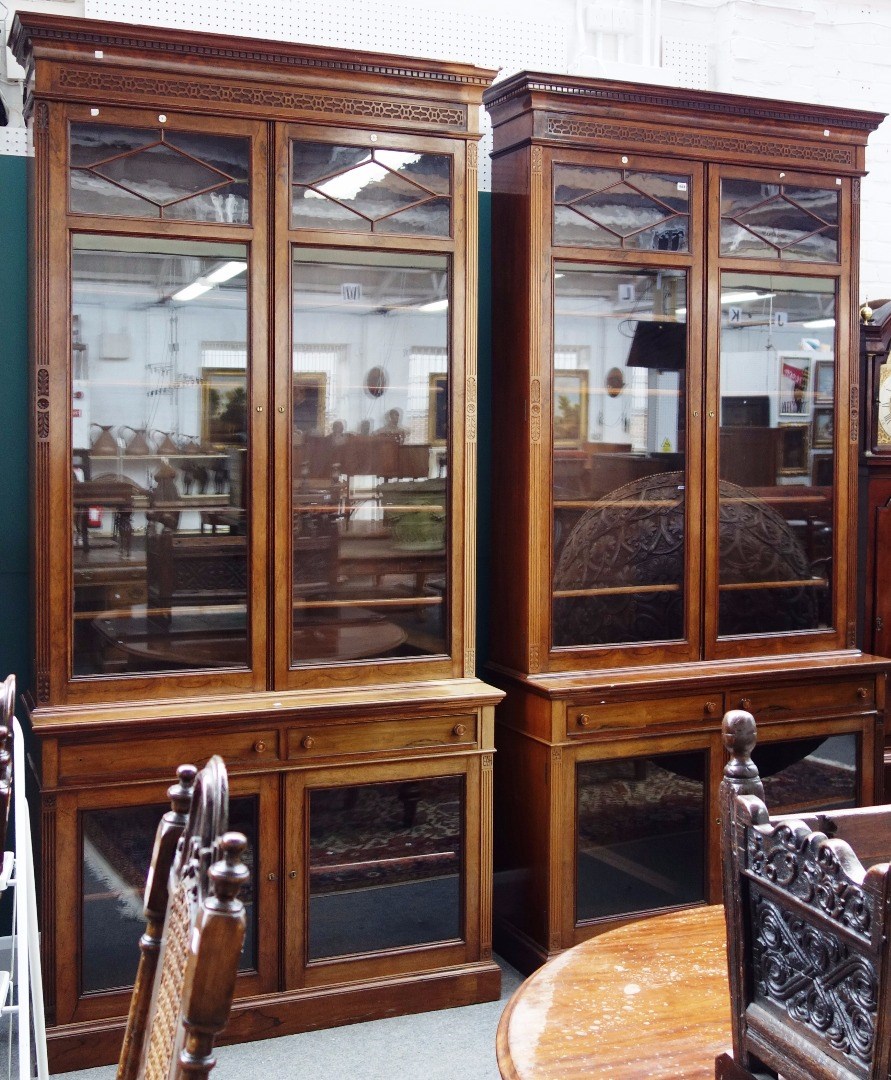 Appraisal: A pair of th century rosewood bookcase cabinets each with