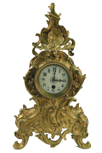 Appraisal: A FRENCH GILT BRONZE MANTEL SHELF TIME PIECE The baroque