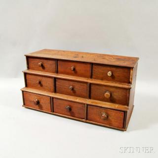 Appraisal: Small Walnut Three-tier Chest th century the stepped case with