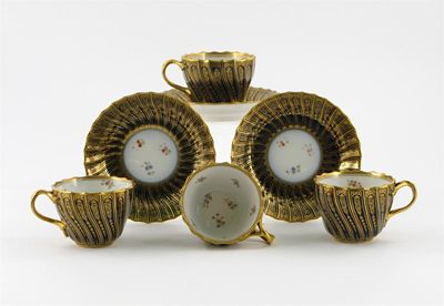 Appraisal: Four Continental teacups and three saucers the fluted exteriors decorated