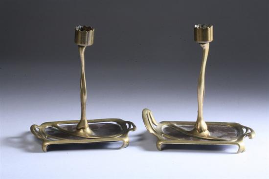 Appraisal: PAIR AUSTRIAN ART NOUVEAU GILT-BRONZE AND COPPER CANDLESTICKS Circa marked