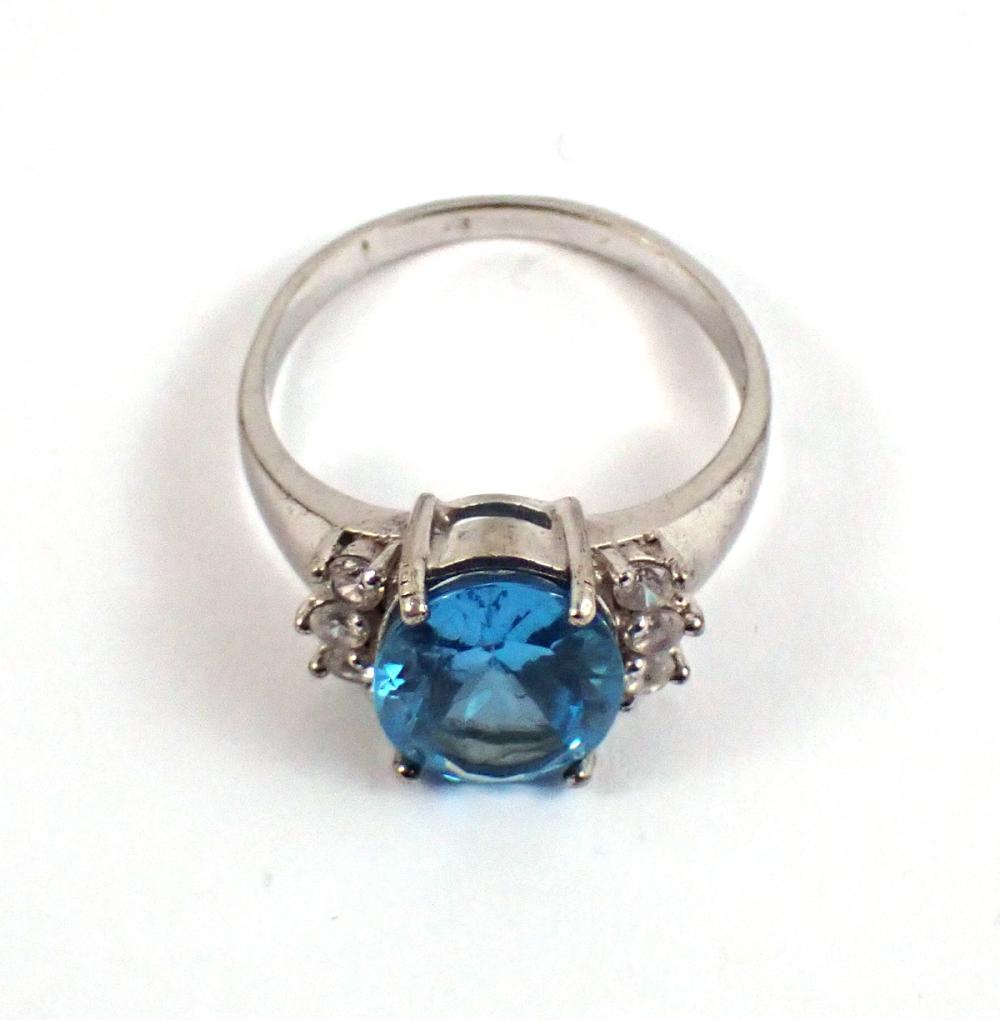 Appraisal: BLUE TOPAZ AND FOURTEEN KARAT WHITE GOLD RING with three