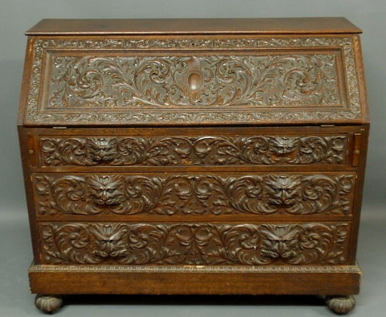 Appraisal: Continental carved elm wood slant-lid desk c h x w