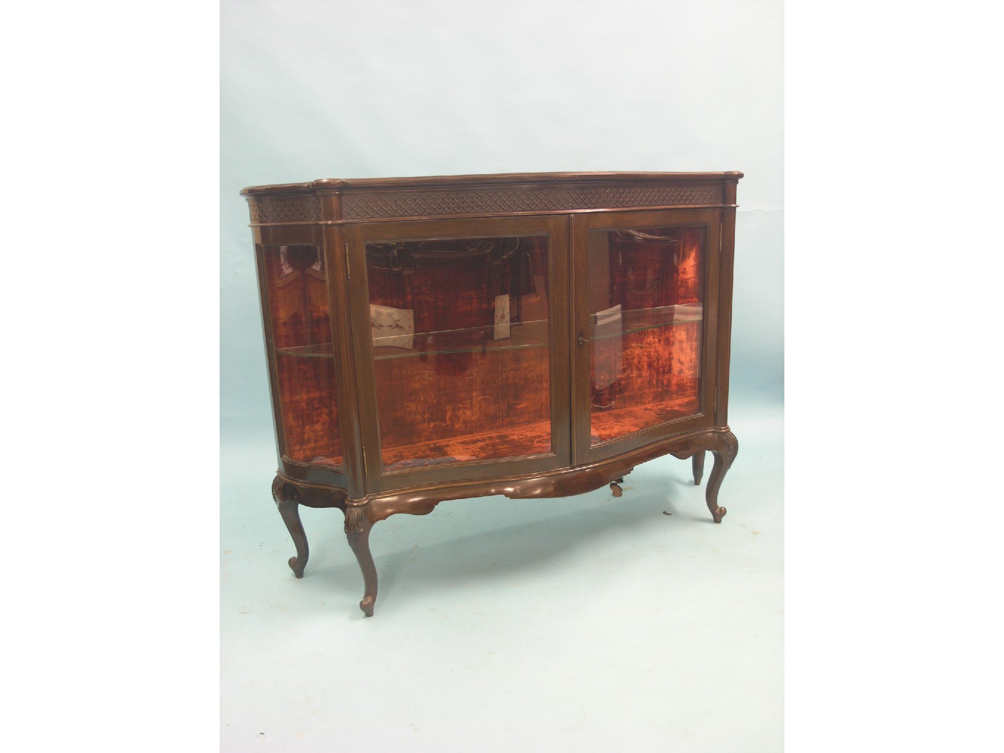 Appraisal: An early th century Maple Co mahogany display cabinet serpentine-fronted