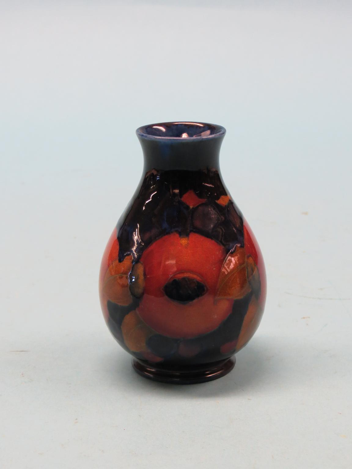 Appraisal: A Moorcroft vase Pomegranate bulbous-shape impressed marks and painted initials