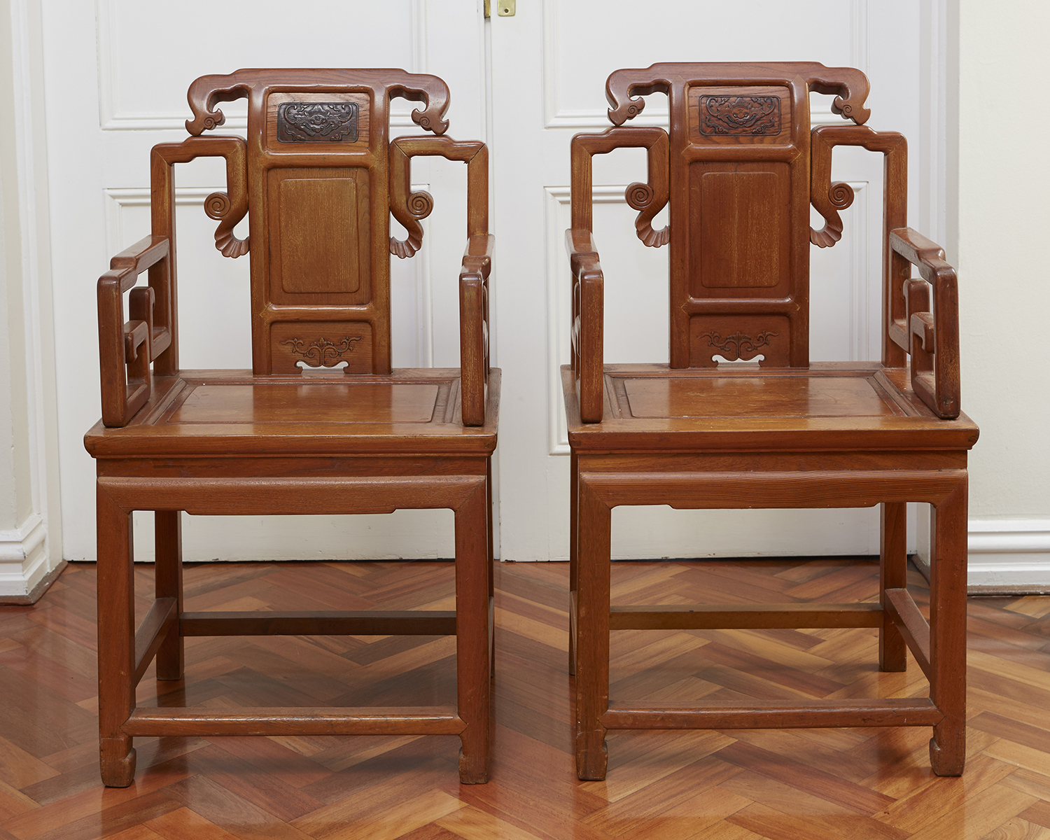 Appraisal: A PAIR OF CHINESE ELM WOOD HALL CHAIRS Of pegged