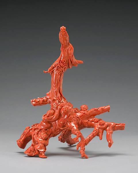 Appraisal: A large coral branch carving of Guanyin children and monkeys