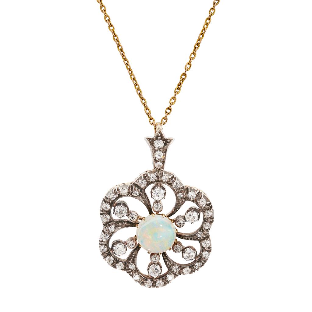 Appraisal: A diamond and opal pendant of pierced floral design set