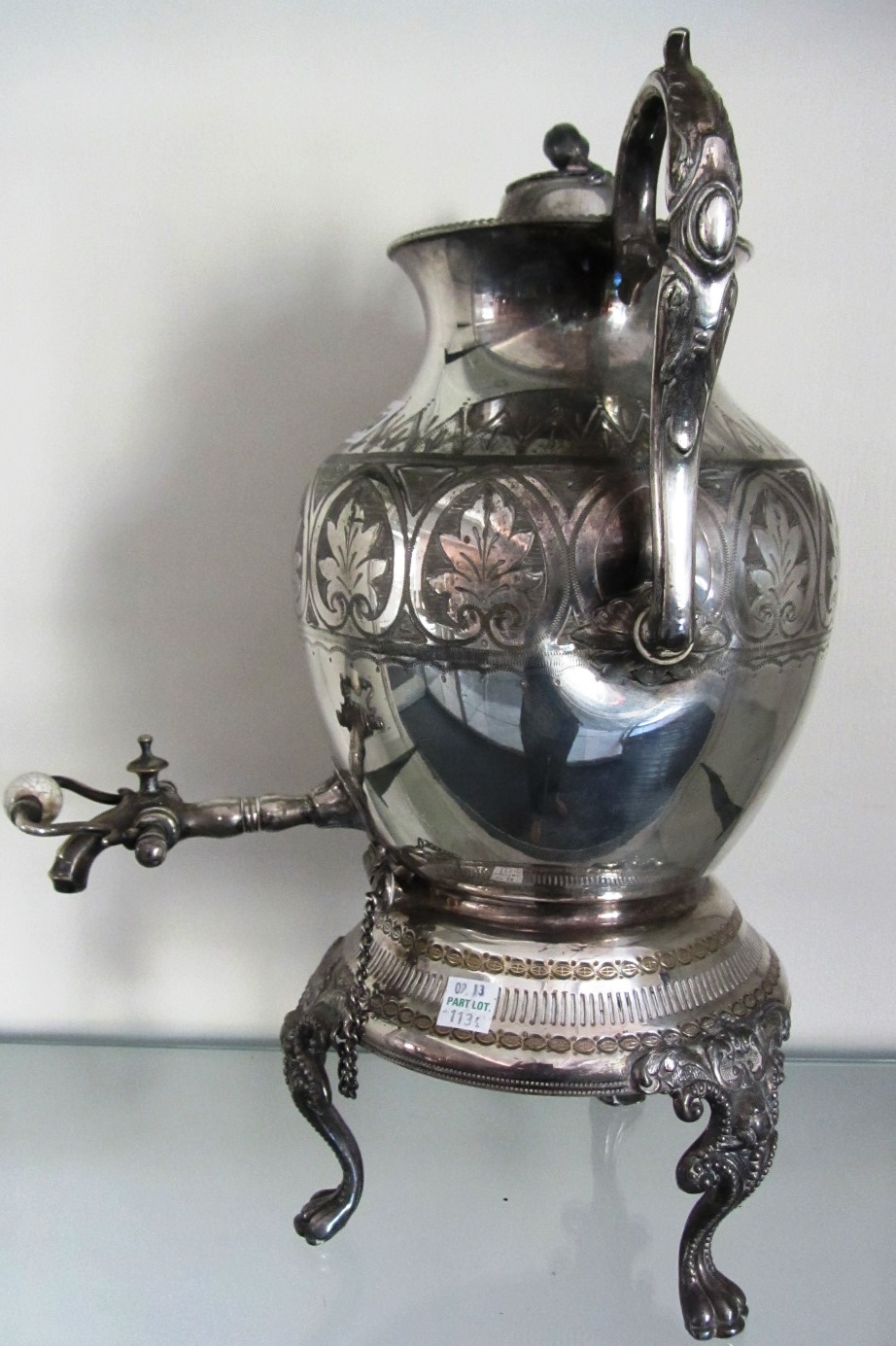 Appraisal: A Victorian plated twin handled lidded tea urn with a