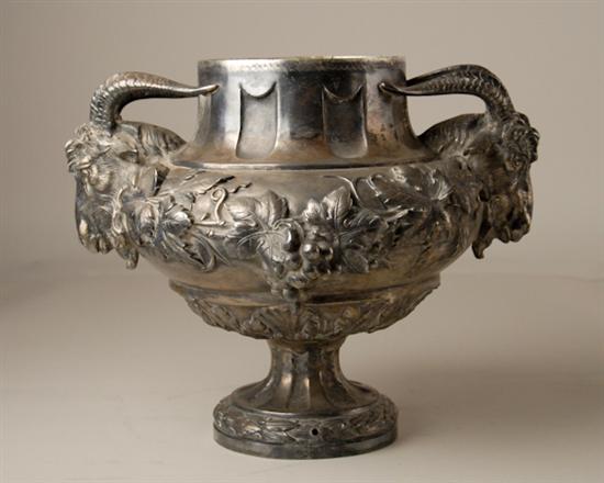 Appraisal: A Footed Silverplated Urn with Rams Head Handles having laurel