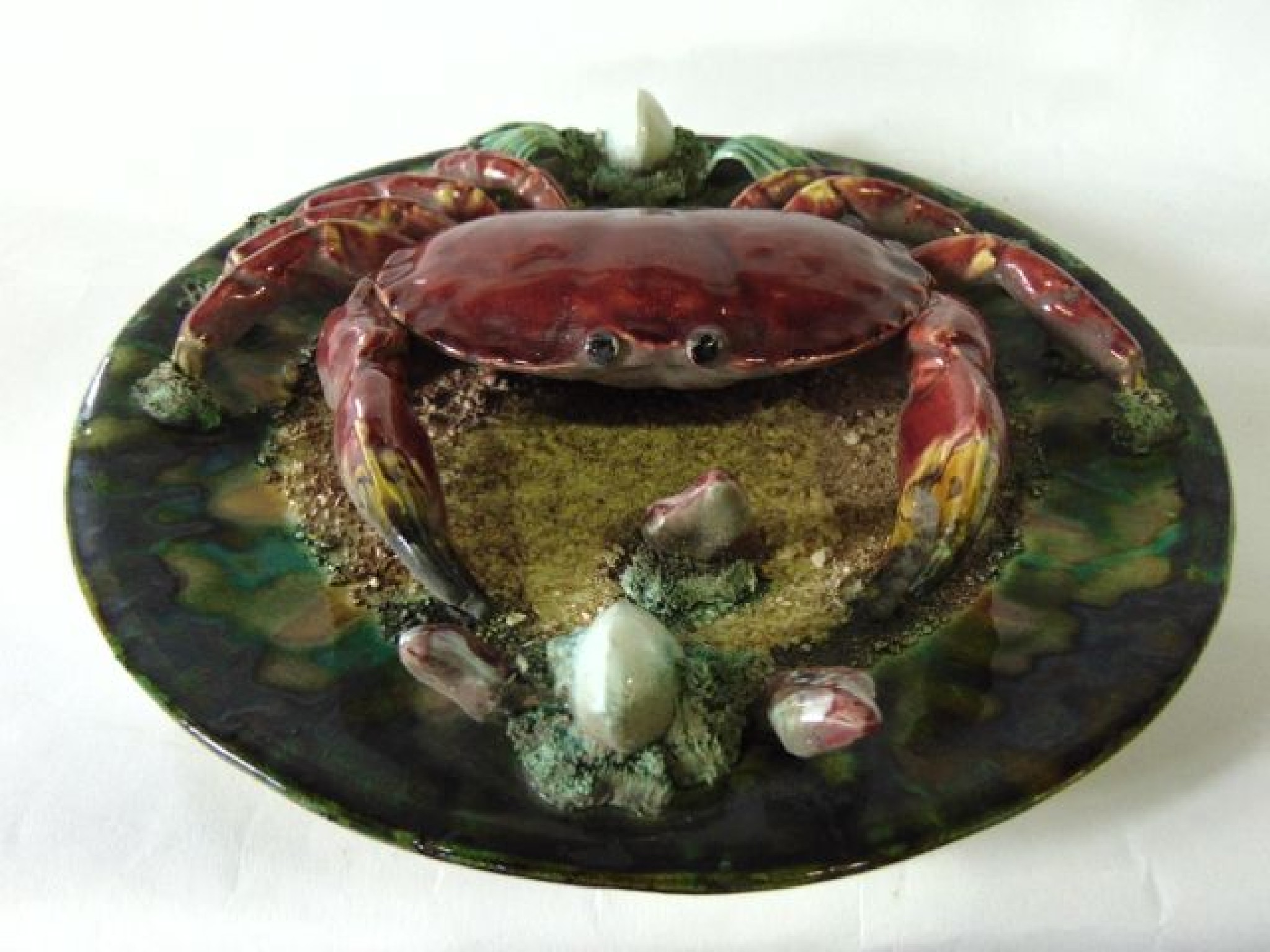 Appraisal: A Portuguese Palissy style charger with applied model of a