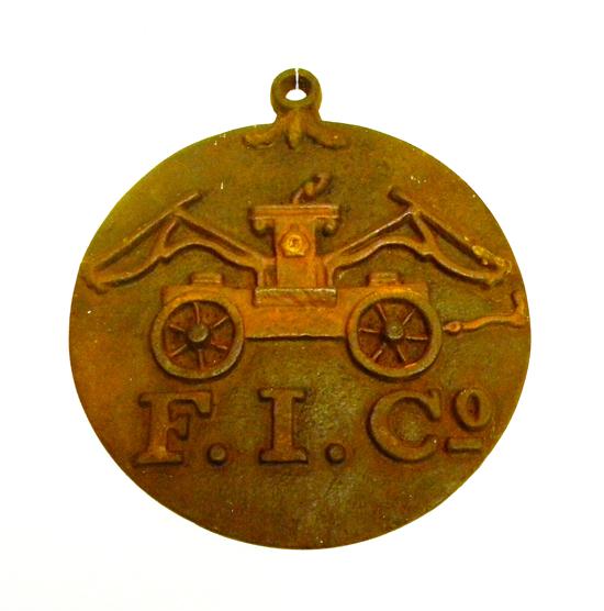 Appraisal: Cast iron fire mark hooked disc with raised fire truck