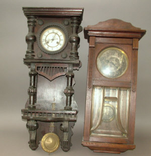 Appraisal: A Continental wooden cased regulator type wall clock the ornate