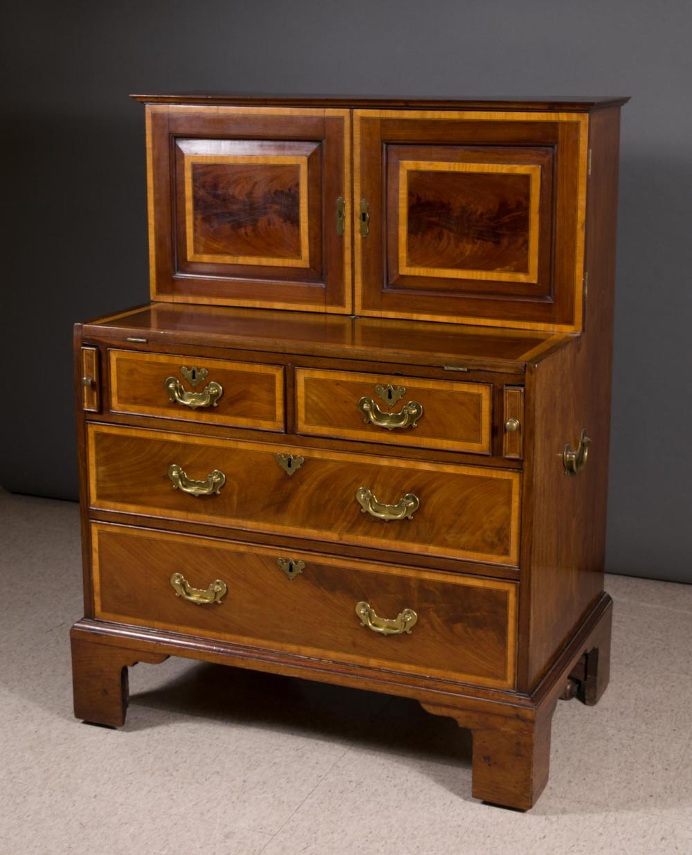 Appraisal: GEORGE III STYLE MAHOGANY CAMPAIGN SECRETARY CHEST William Williamson Sons