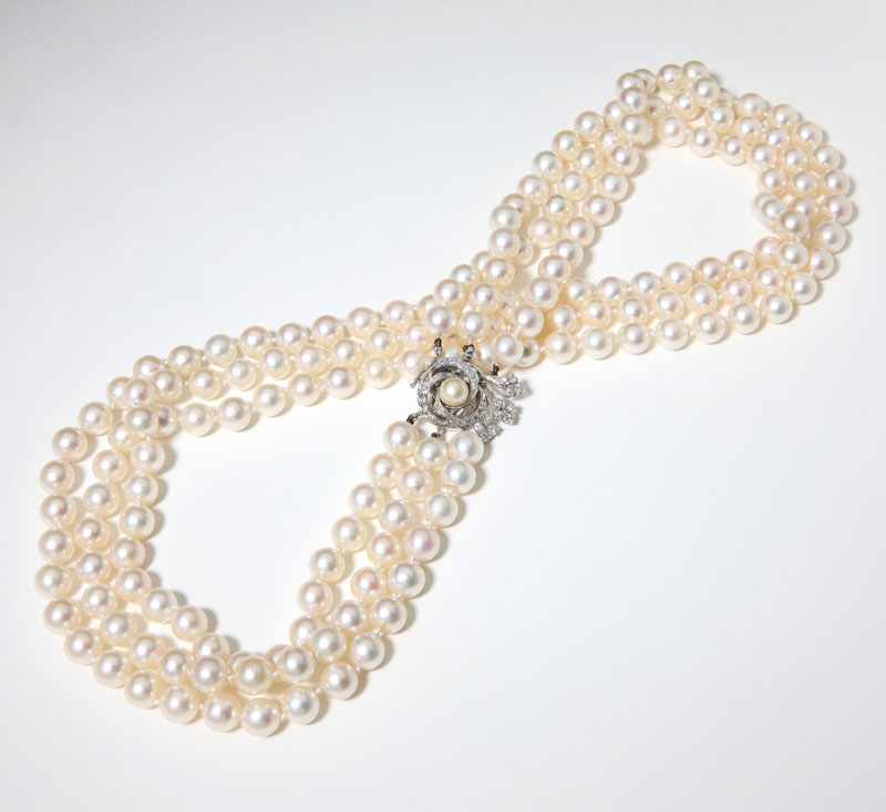 Appraisal: Triple strand of cultured pearls measuring mm with a tested