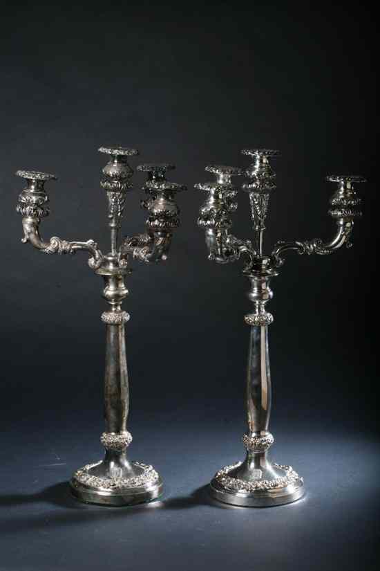 Appraisal: PAIR SHEFFIELD PLATE FIVE-LIGHT CANDELABRA Early-to-mid th century Circular foot