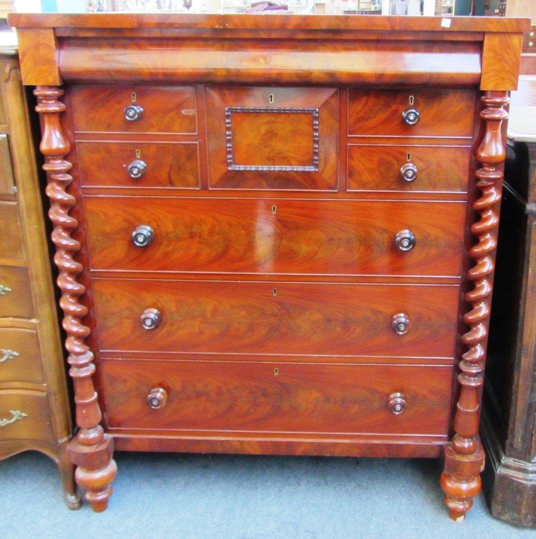 Appraisal: A th century Scottish mahogany chest the cushion frieze drawer